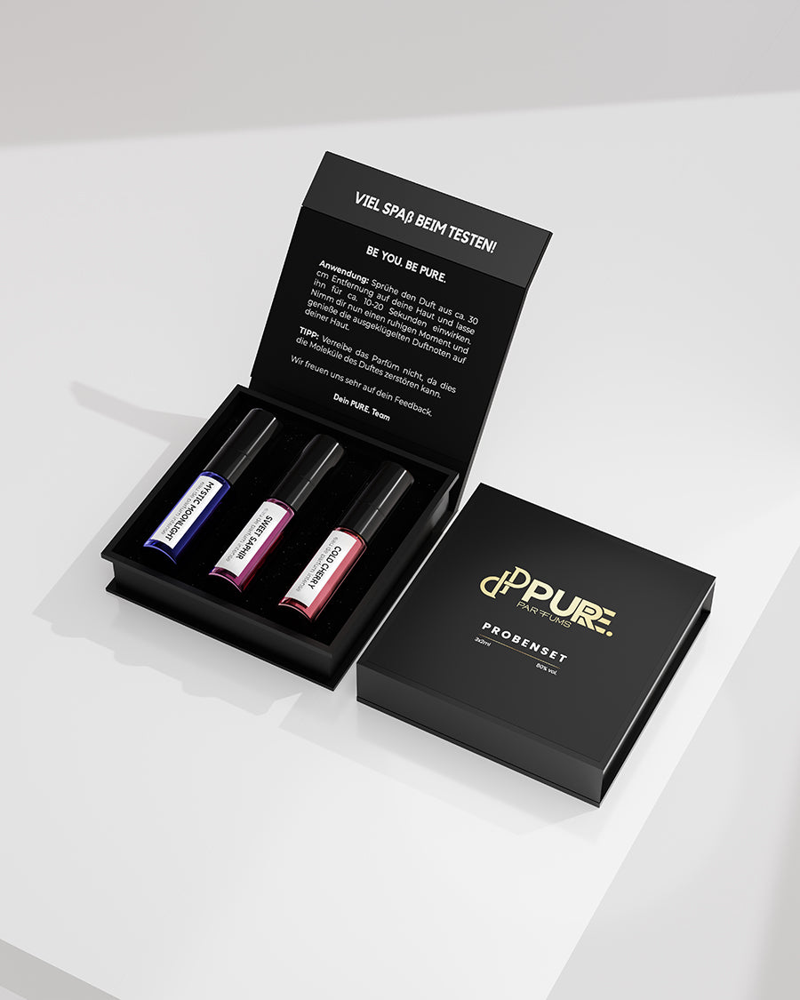 Frauen-Probenset von Pure Parfums mit 2ml Proben der Düfte Cold Cherry, Mystic Moonlight und Royal Ruby, angeboten in einer ansprechend gestalteten Verpackung, die die Exklusivität und Weiblichkeit der Aromen betont.